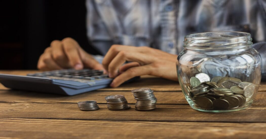 man-calculating-monthly-savings (1)-min